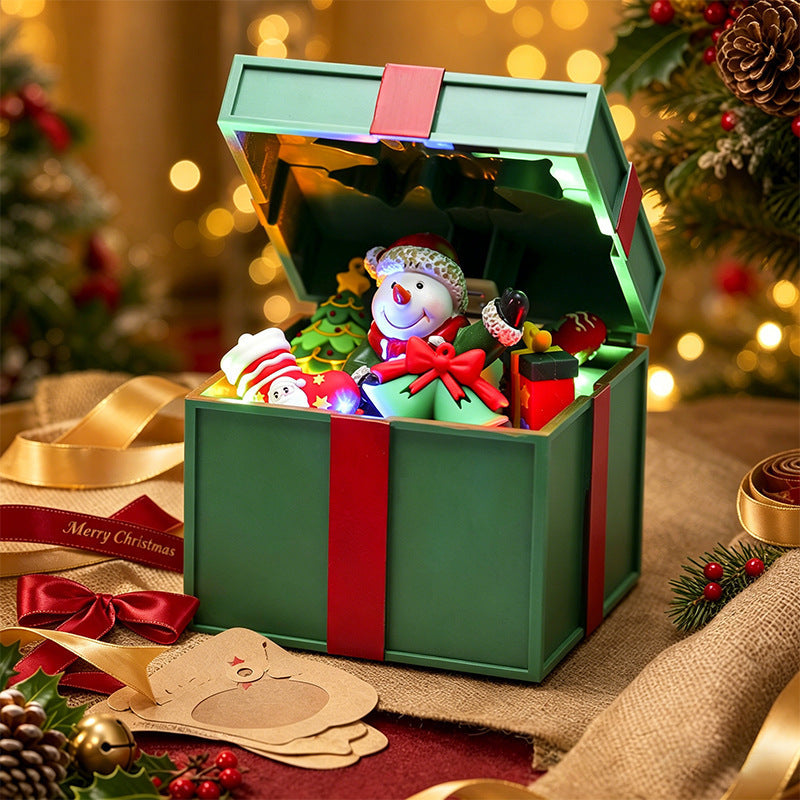 Illuminated Christmas village decoration with moving figures
