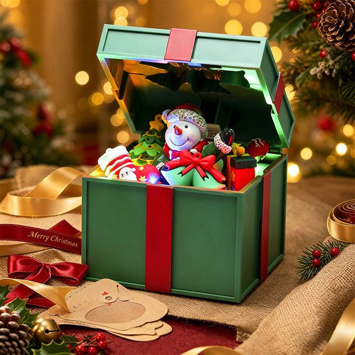 Illuminated Christmas village decoration with moving figures