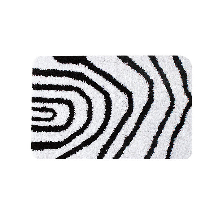 Fluffy bath mat in a graphic wave relief with anti-slip base