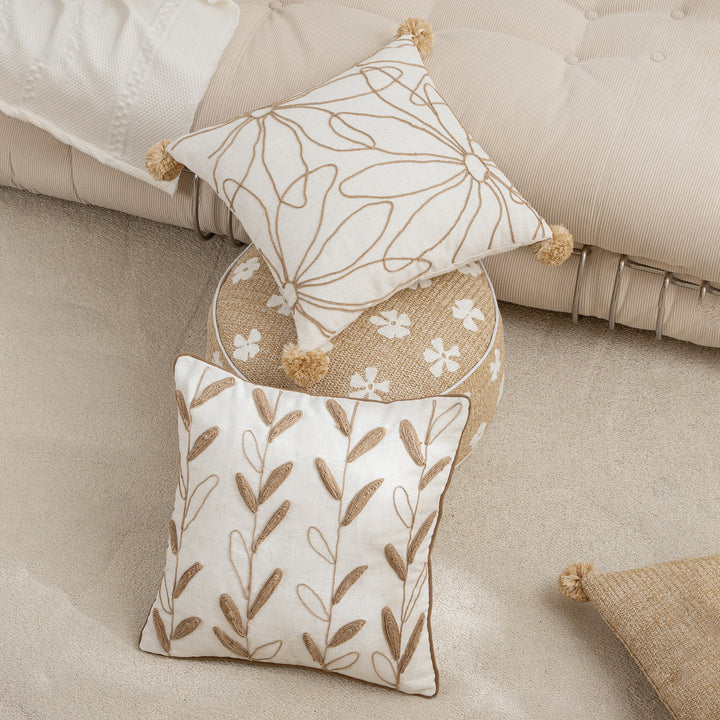 Decorative linen cushion with hand-stitched jute application