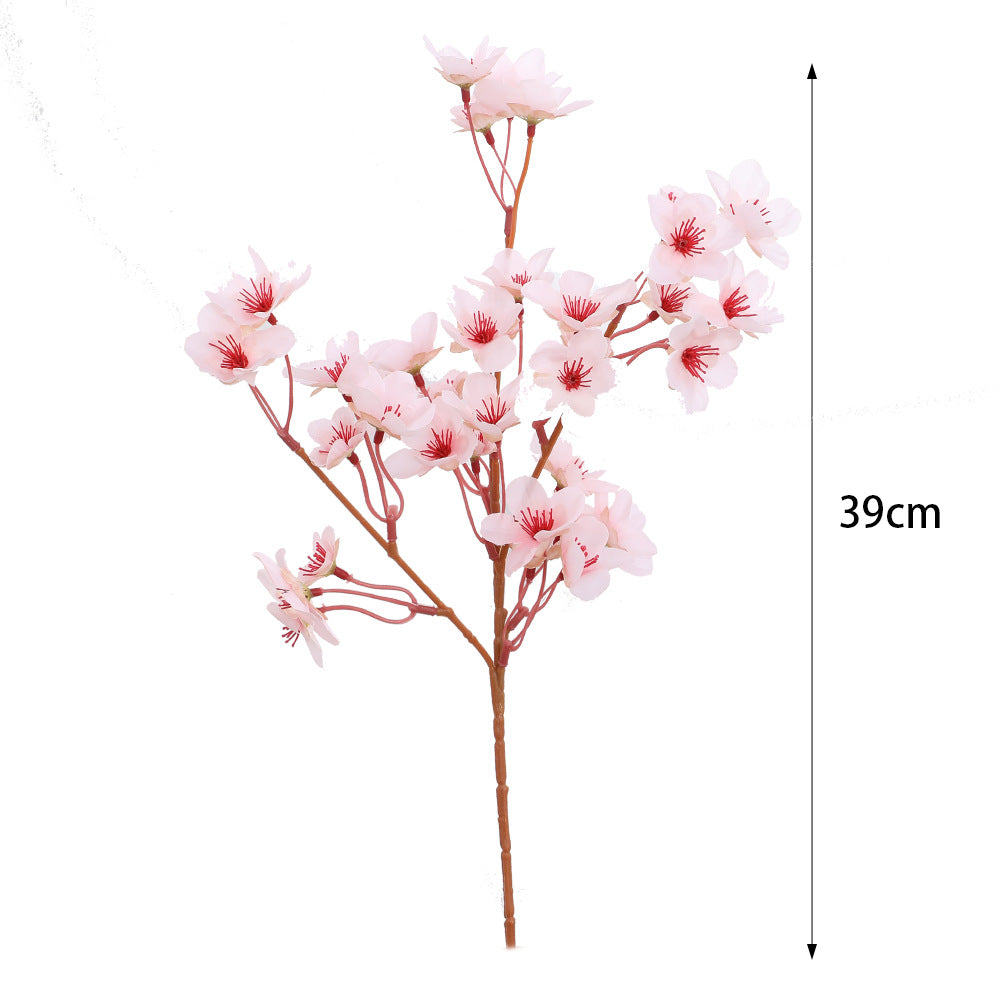 Artificial cherry blossom branch with detail-loving flowers