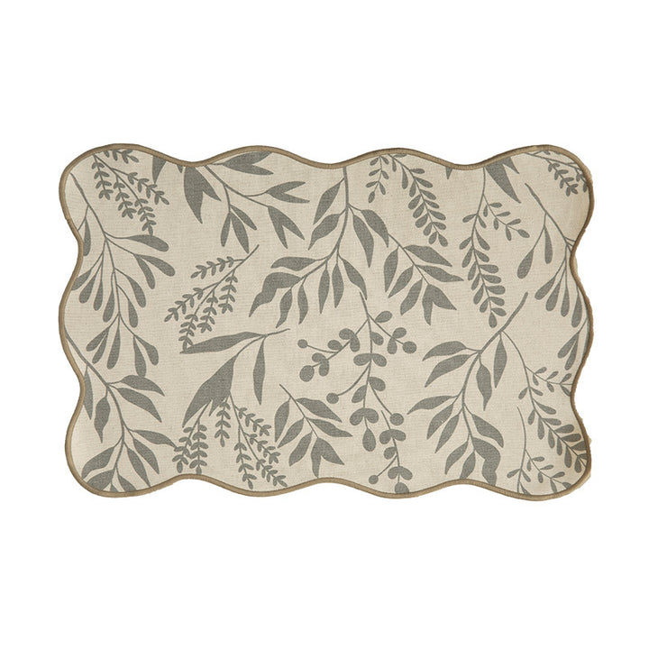 Shaped placemat made of cotton-linen with wavy edge and leaf pattern