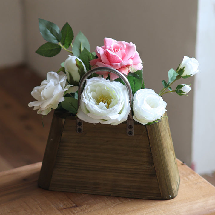 Handcrafted wooden basket with metal handles