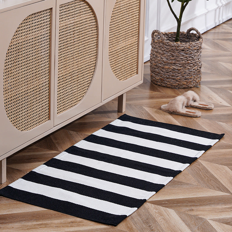 Flat-woven runner rug with check pattern and decorative border stripe