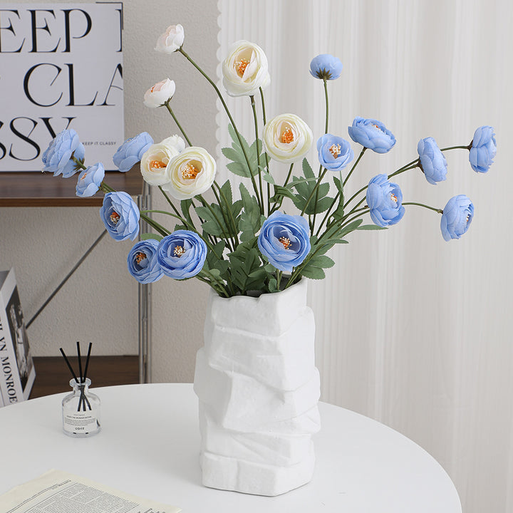 Decorative artificial flower bouquet with intricately detailed ranunculus