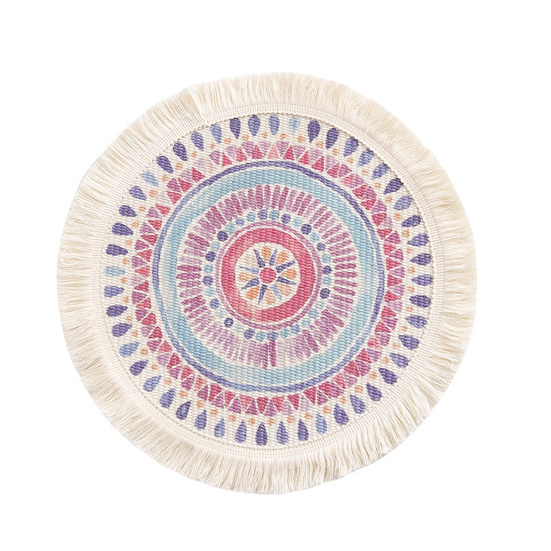 Round flat-woven cotton rug with mandala design and decorative fringes