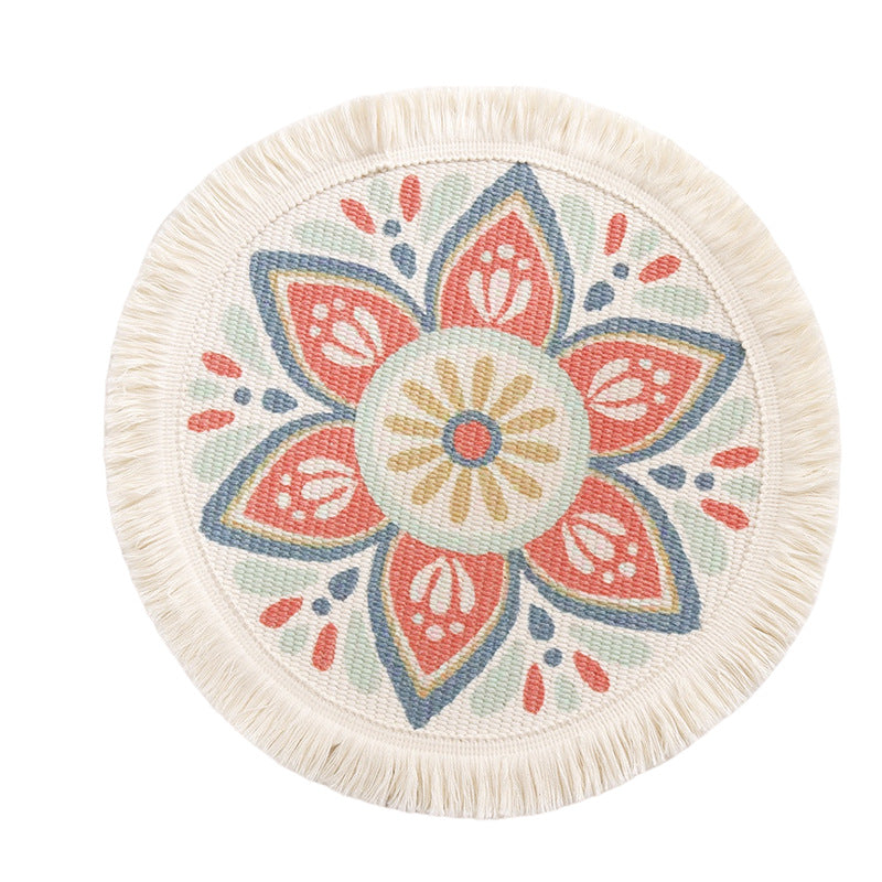 Round flat-woven cotton rug with mandala design and decorative fringes