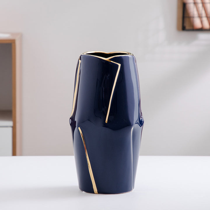 Decorative ceramic vase with golden accents