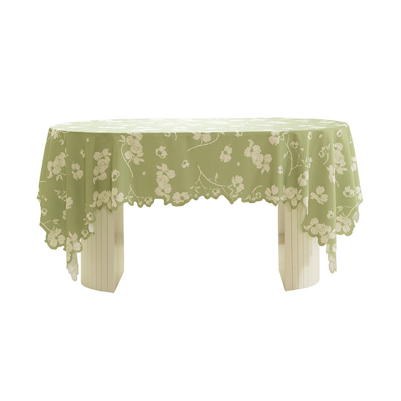 Round wipeable tablecloth with floral cut-out hem