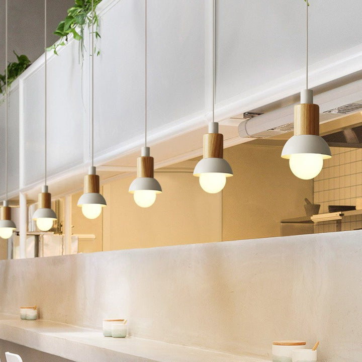 Minimalist wood and metal pendant lamp with small shade dome