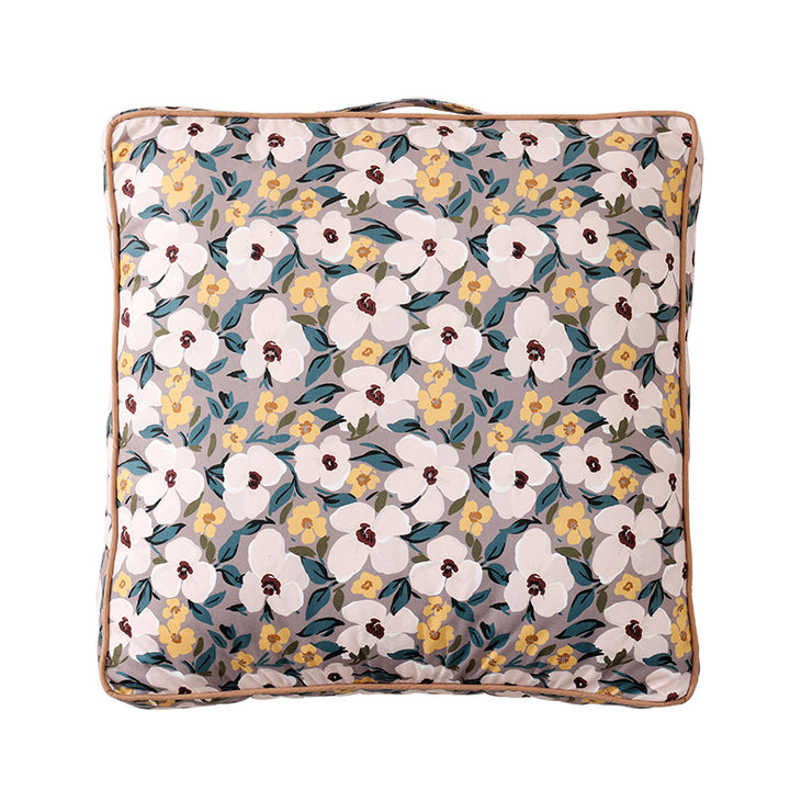 Large square floor cushion with floral cotton cover, piping, and carrying handle