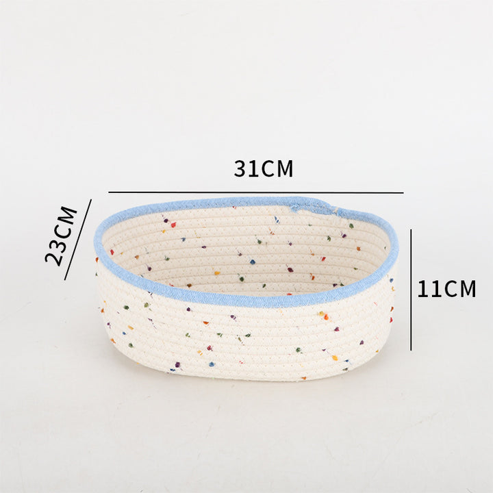 Storage basket made of natural cotton fabric with colorful dots