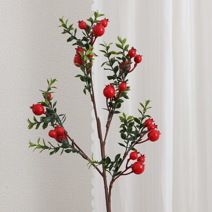 Artificial branch with glowing red berries