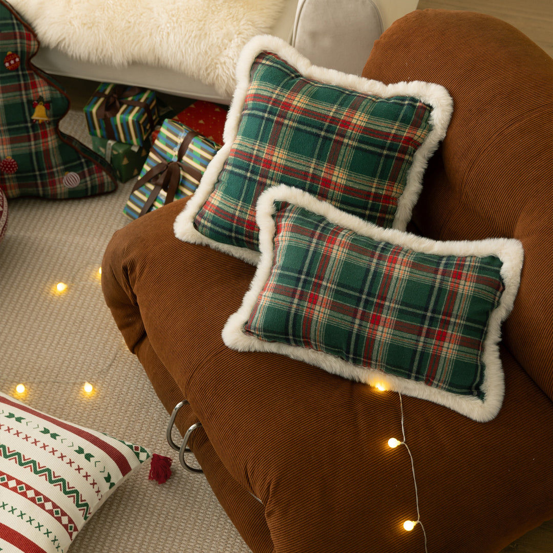 Christmas tree-shaped decorative pillow made of checked flannel with embroidered appliqués