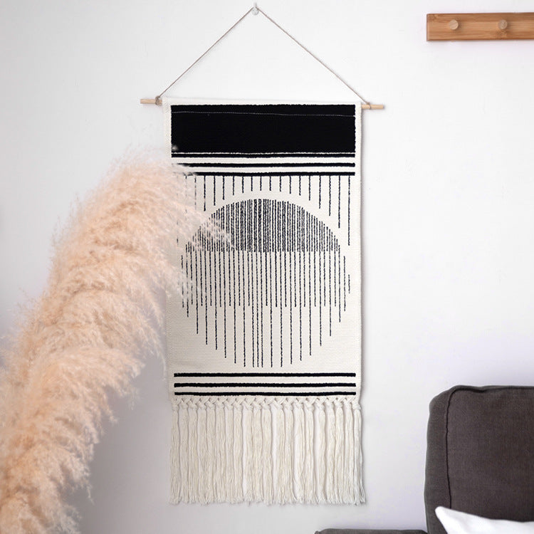 Woven Boho wall tapestry in Ethno design with long fringes and wood stick