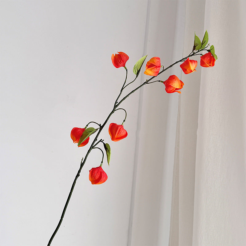Artificial flower branch with fine, vibrant flowers and natural look