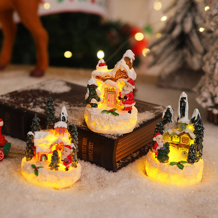 Christmas miniature lighting with snow scenes