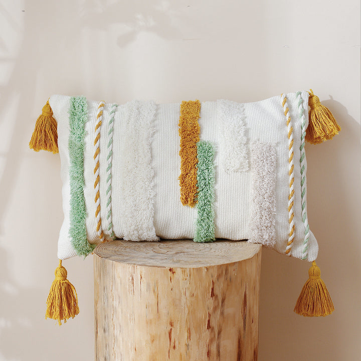 Decorative cotton cushion with hand-tufted relief and decorative tassels