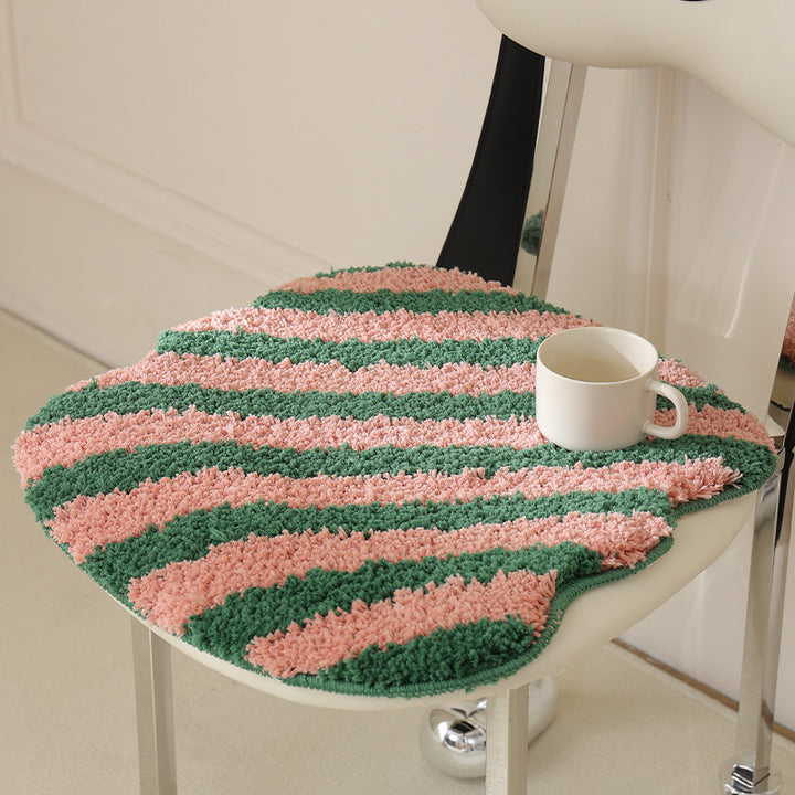 High-pile bath mat rug with diagonal stripe structure and organic shape