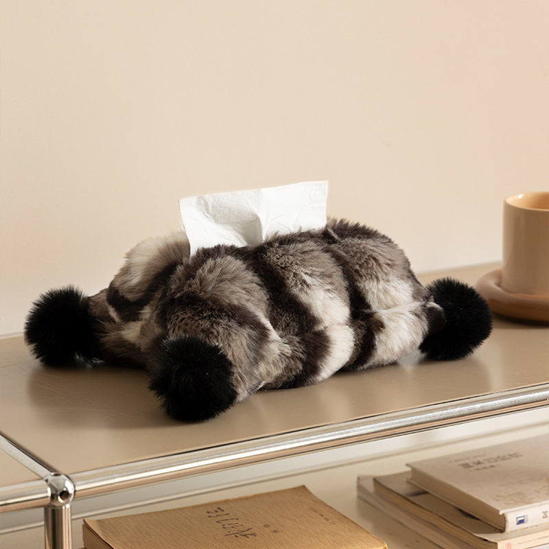 Cozy tissue box cover made of artificial fur with pom-pom application