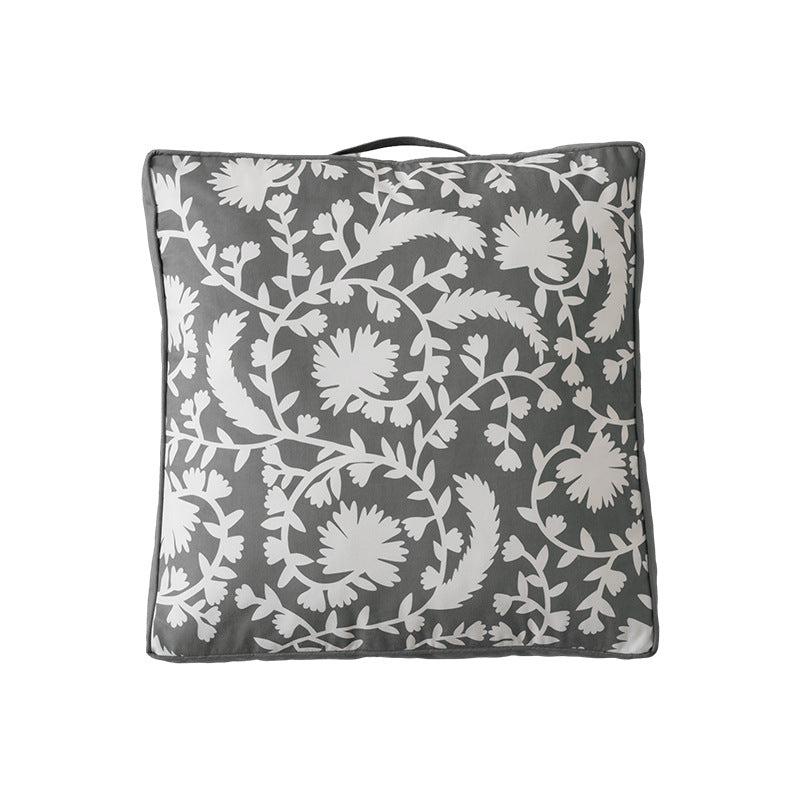 Padded chair cushion with carrying handle and decorative stitching