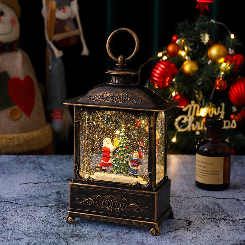 Glittering Christmas lantern with snow scenes