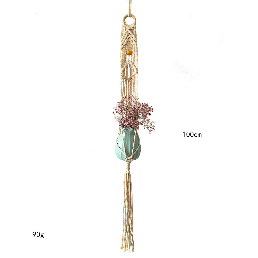 Macrame plant hanger with decorative tassels