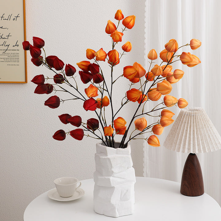 Artificial flower branch with vibrant flowers