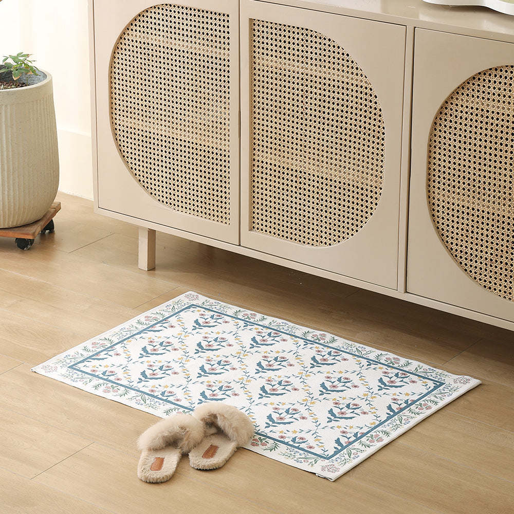 Woven cotton bath mat with floral allover jacquard pattern