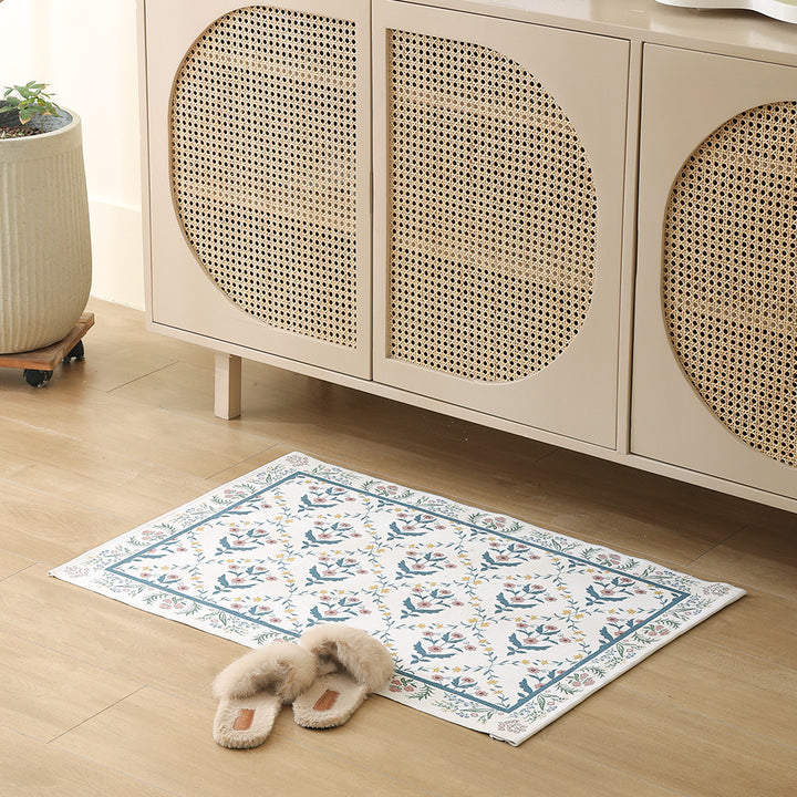 Woven cotton bath mat with floral allover jacquard pattern