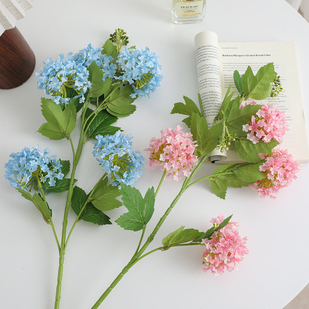 Artificial hydrangea branch with vibrant flowers and detailed leaves