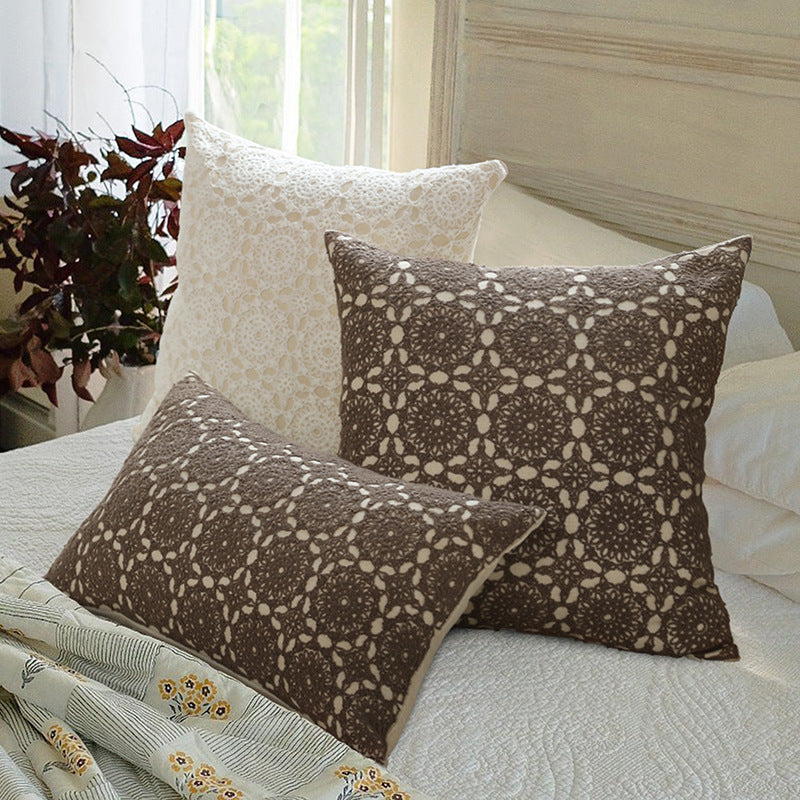 Square decorative cushion with crocheted ornament overlay and linen texture
