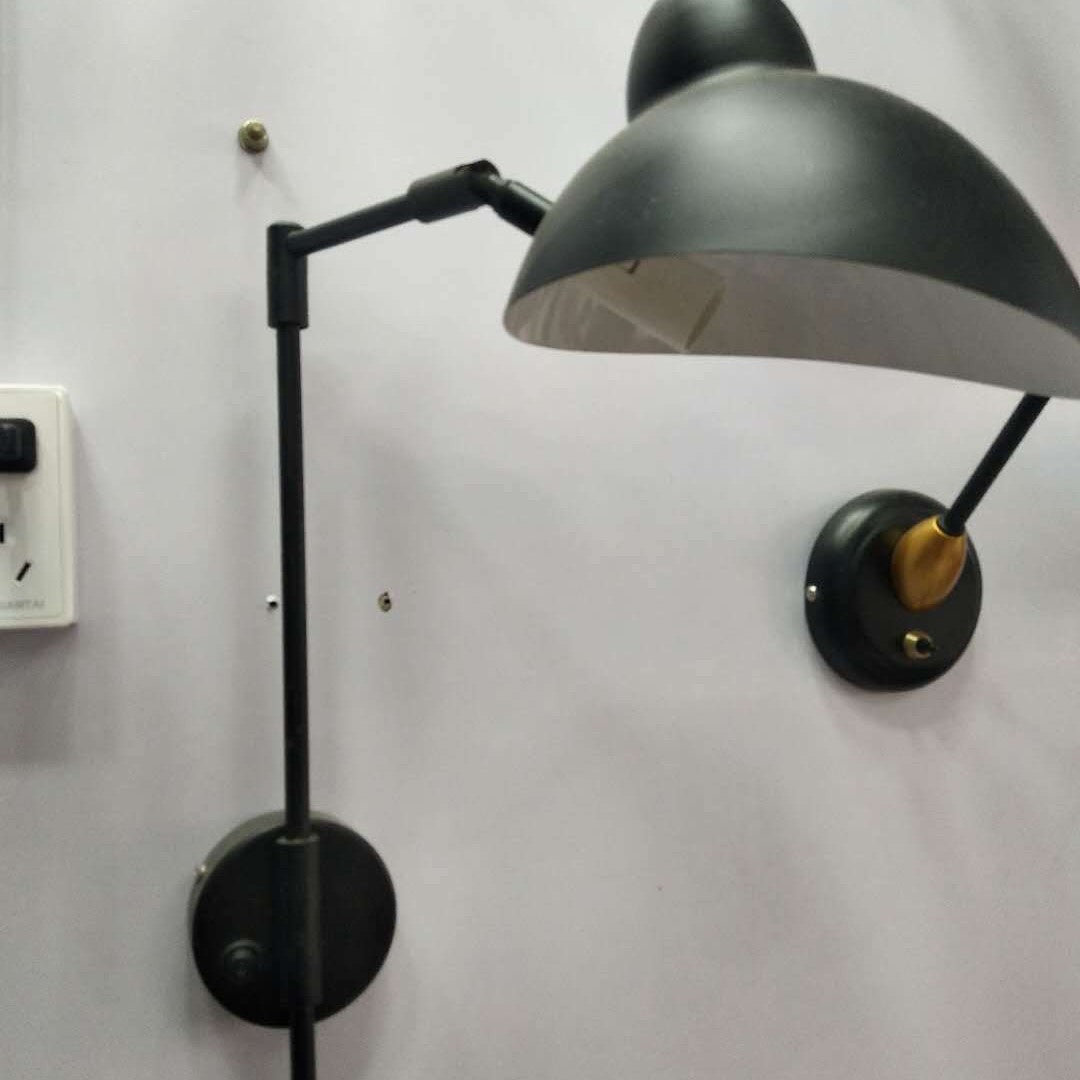 Articulated wall lamp with curved arm and adjustable bell shade