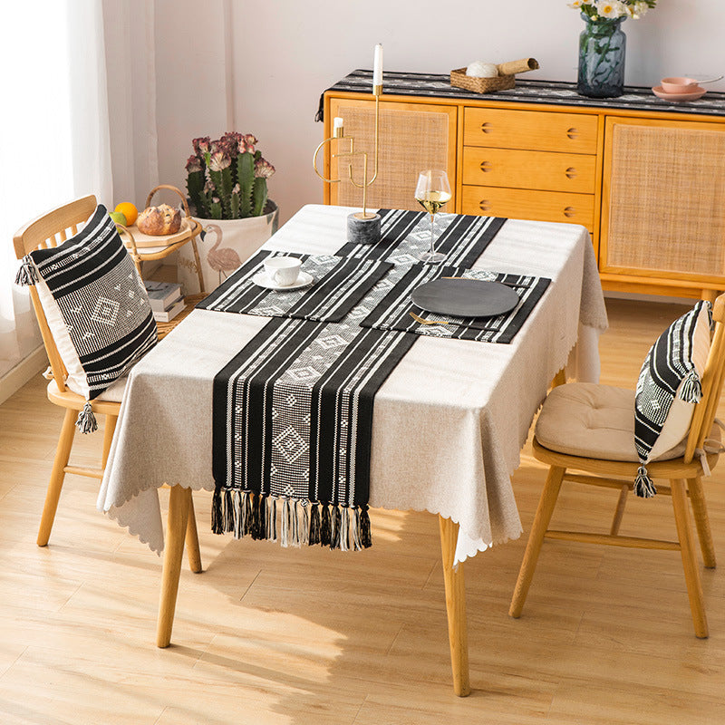 Handwoven table runner made of cotton blend with fringes and geometric dot jacquard