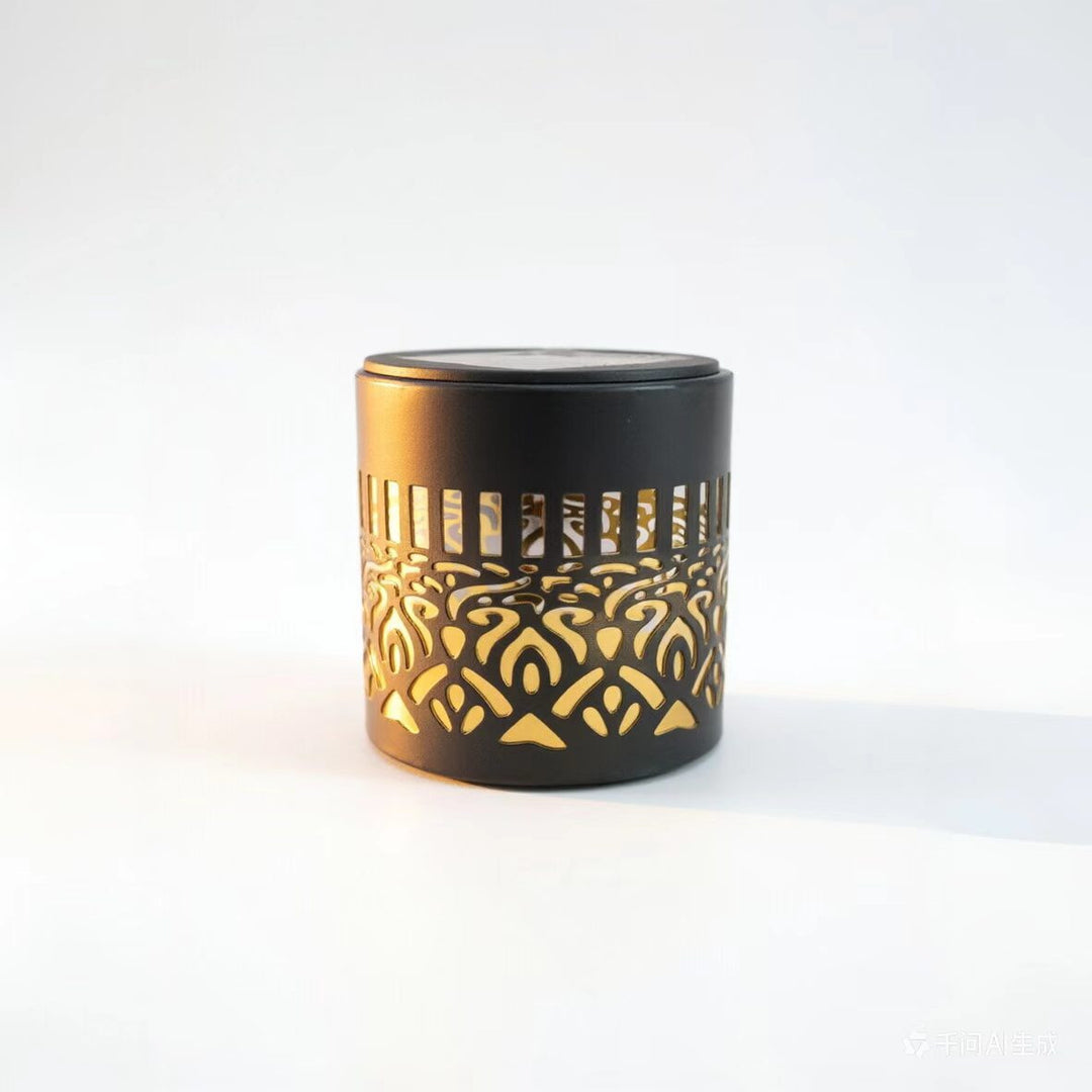 Decorative filigree metal tealight lantern with reflective inner lining