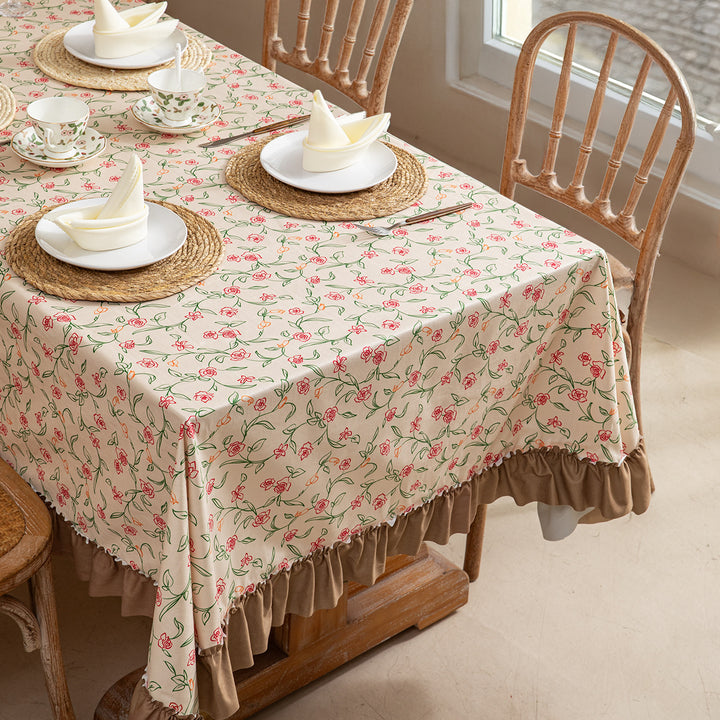 Rectangular tablecloth made of cotton blend fabric with fine floral print and gathered hem