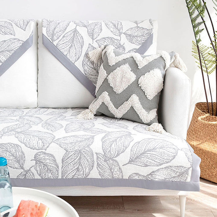 Universal sofa protective cover for three-seater with leaf print, non-slip underside and separate armrest covers