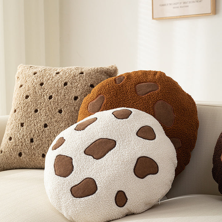 Round cuddle seat cushion with teddy fleece and abstract patch appliqués