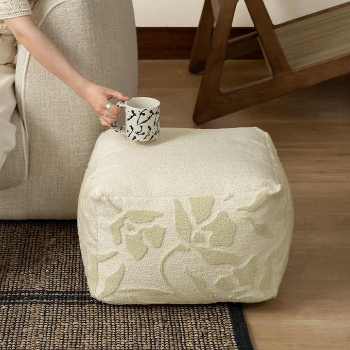 square pouf with bouclé cover and textured jacquard pattern