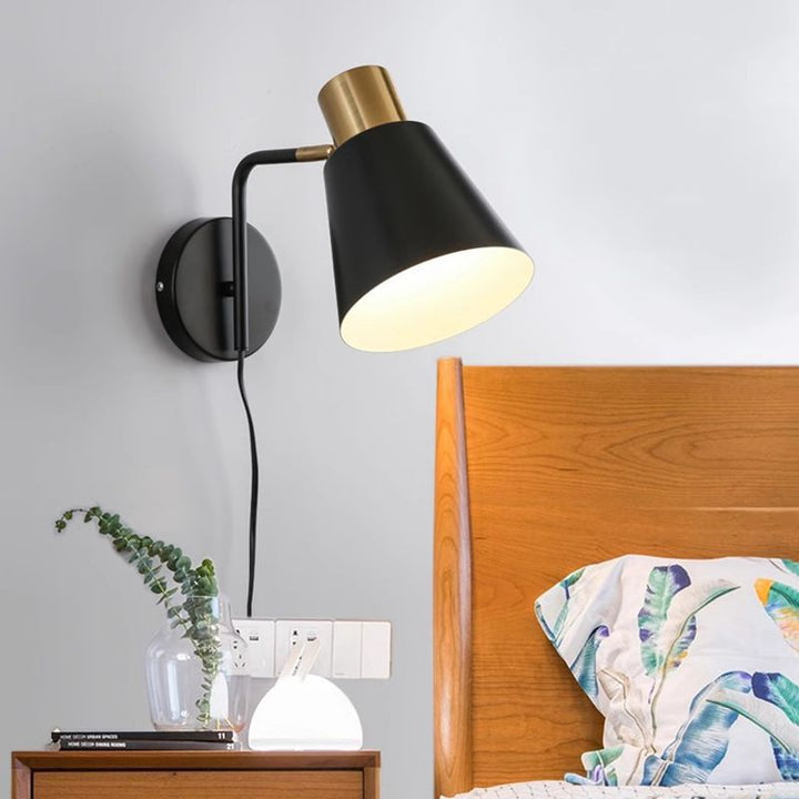 Rotatable cone wall light with brass socket and round back plate