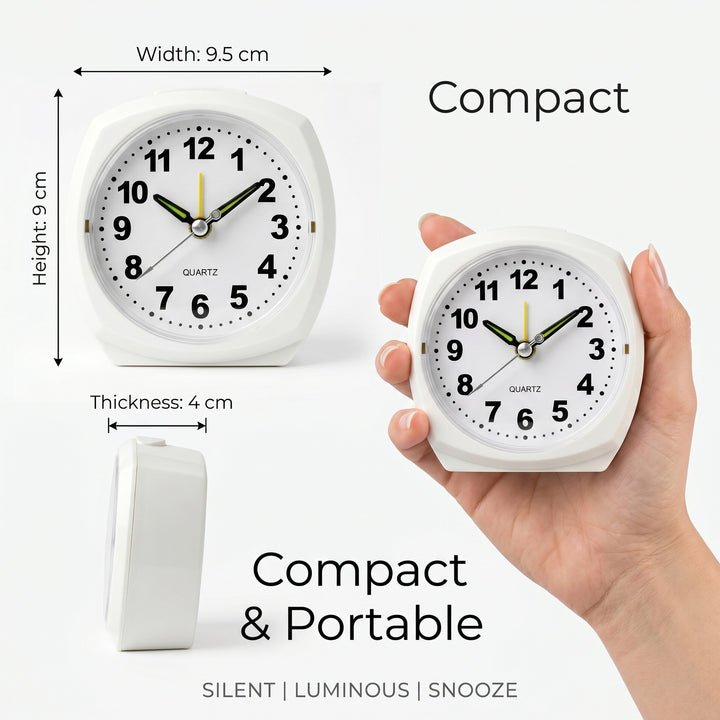 Analog alarm clock with night light and snooze function