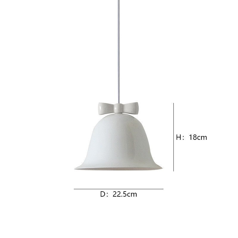Bell-shaped ceramic pendant light with decorative bow accent