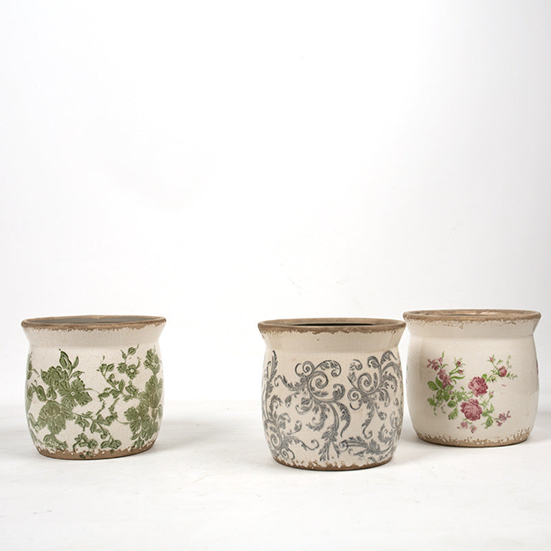 Decorative ceramic plant container with artistic design