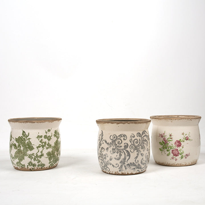Decorative ceramic plant container with artistic design