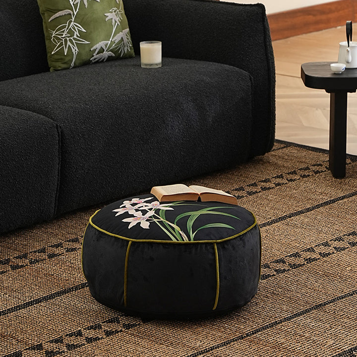 round floor sitting pouf with butterfly motif and sturdy canvas cover
