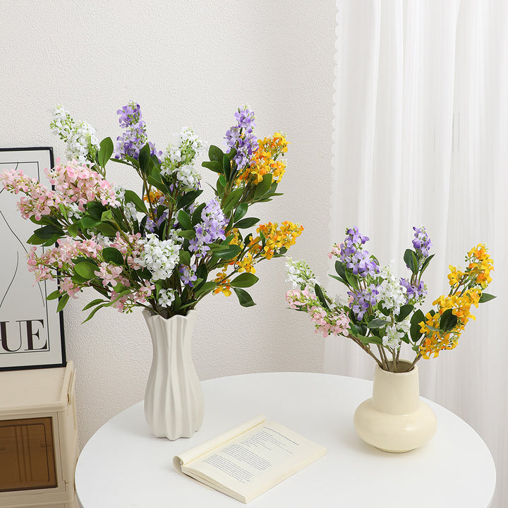Artificial flower branch with bright flowers