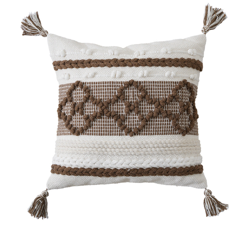 Structured decorative pillow with tufted diamonds, relief border, and corner tassels