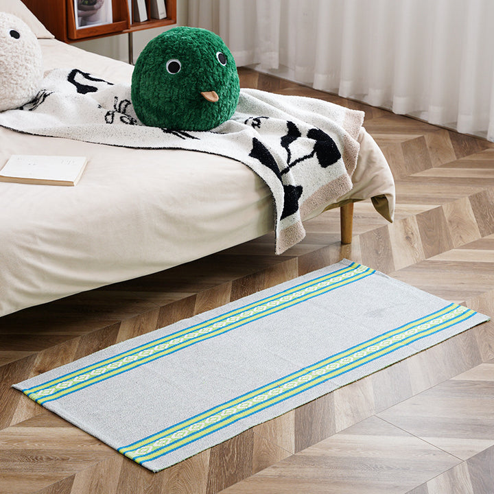 Flat-woven runner rug with check pattern and decorative border stripe