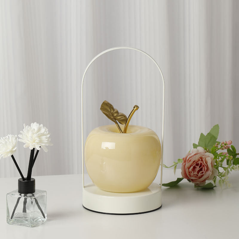 Ceramic apple-shaped ambient table lamp with brass handle