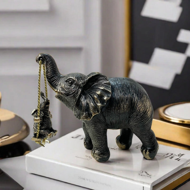 Decorative elephant figurine with child